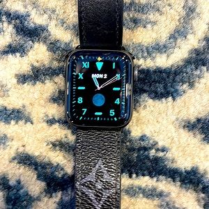 Apple Watch series 6 40mm includes charger and three bands, all black.